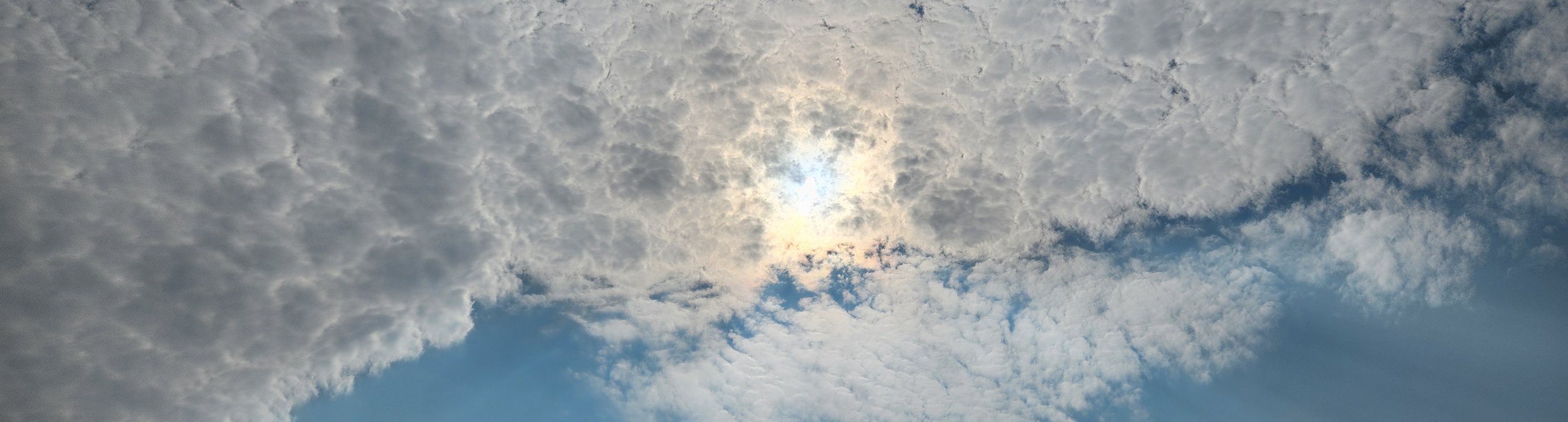 Mackerel sky over the water